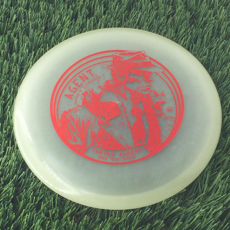 Dynamic Discs Lucid-X Moonshine Glow Agent with Carter Ahrens Secret Agent Team Series 2023 Stamp – 175g – Translucent Glow