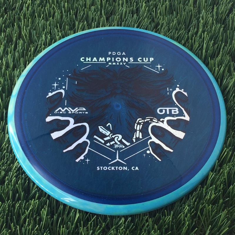 Axiom Particle Glow Proton Hex 5|5.5|-1|1 with OTB Champions Cup 2025 – Wizardcraft by Mike Inscho Stamp – 176g – Turquoise Rim Blue
