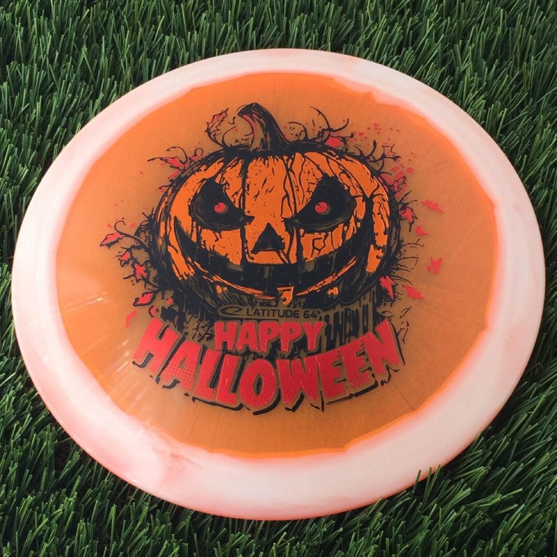 Latitude 64 Opto Ice Orbit Saint Pro with Happy Halloween Spooky Pumpkin – Triple Foil 2024 Stamp – 174g – Translucent Orange